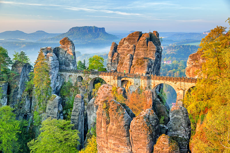 Bastei Bridge is a unique rock formation that lies along the Elbe River. It’s accessible via train, bus or boat from Dresden. 