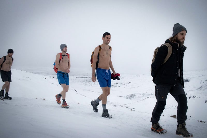 Hiking up to the top of a mountain in bathing suit during a Wim Hof retreat