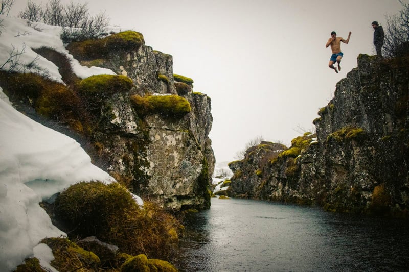 Jumping into an ice cold lake during a cold immersion retreat in Iceland
