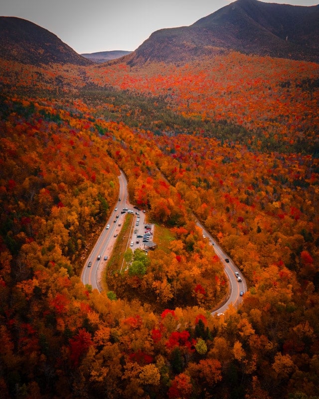 Take a drive down the Kancamagus Highway, one of the cool places to vacation in the US.