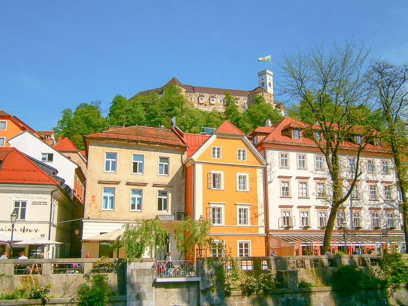 Located in one of the cheapest European countries to live, Ljubljana Castle towers over the colorful city below. 