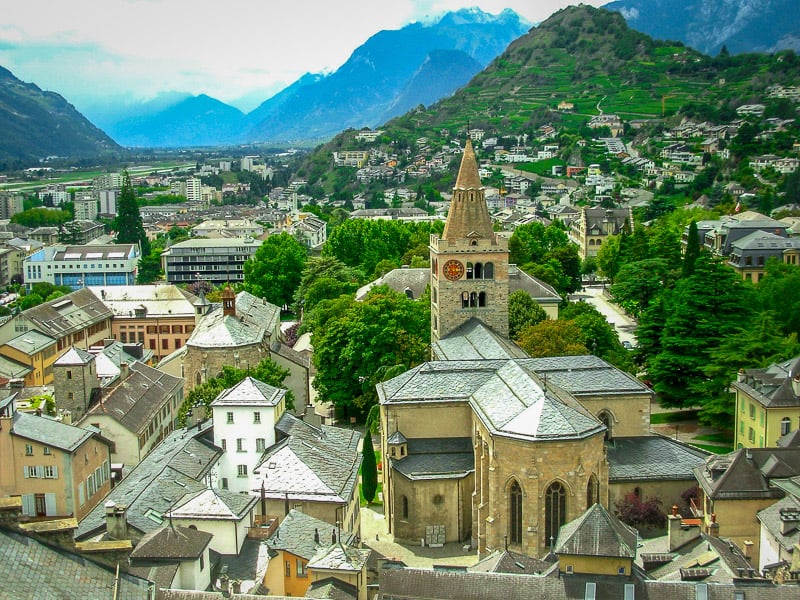 Sion is surrounded by mountains and vineyards.