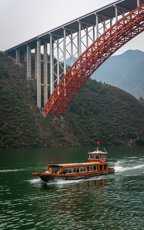 Small river boats are needed to traverse the Mini Three Gorges, a tributary of the Yangtze River.