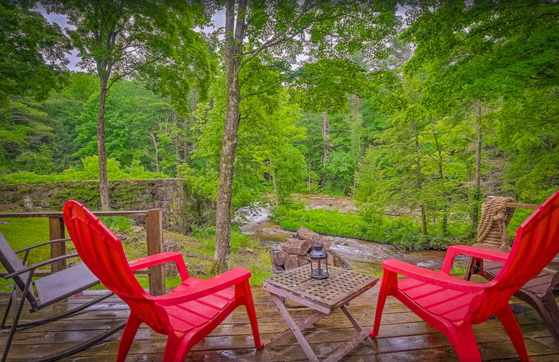 Spectacular views of the river from your own private deck at this New England cabin rental.