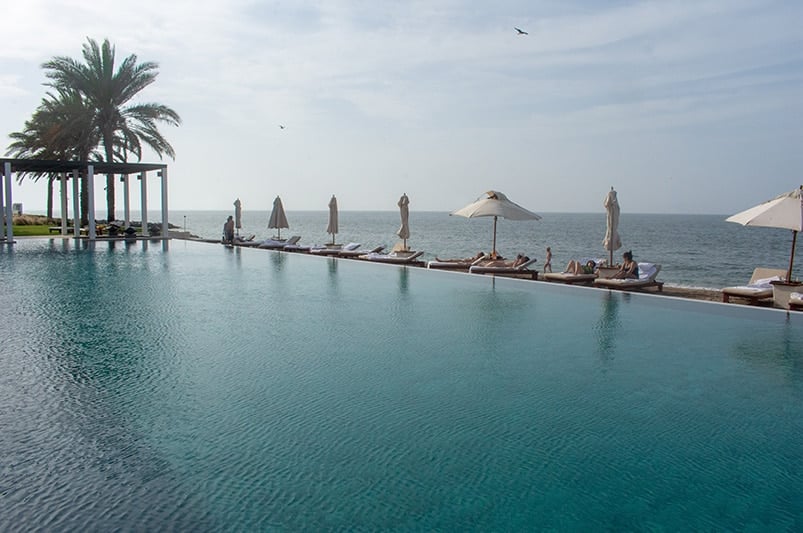 The Chedi Pool blends into the Gulf of Oman.