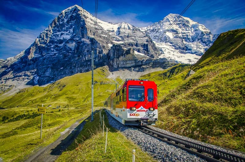 A train ride through the Swiss Alps is the ultimate travel bucket list idea.