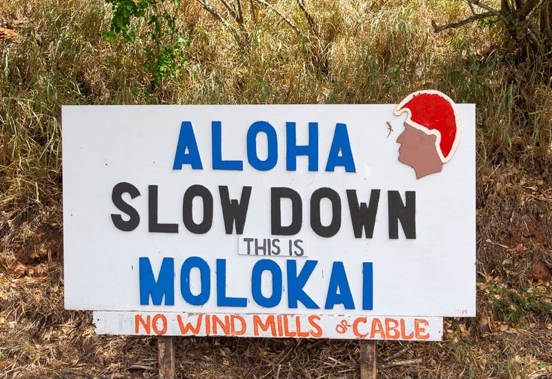 In this travel guide of Molokai, it's important to point out that this is the very first sign you'll see on the island.