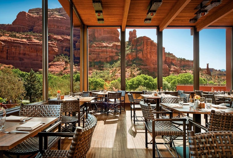 Dining room of one of the best wellness retreats in the world overlooking red rocks of Sedona, Arizona.